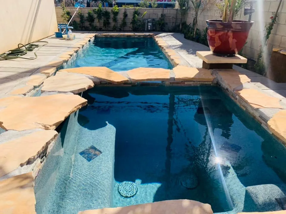 Stone-clad spa with clear blue water