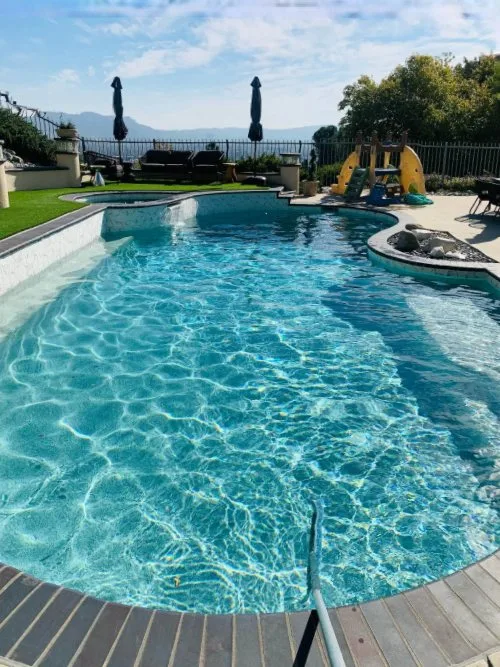 Clear pool water in a backyard pool