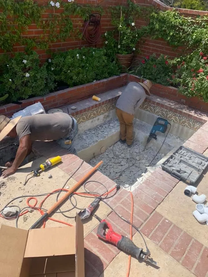 Spa tile work in progress with technicians and tools