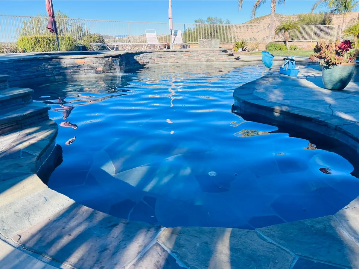 Rock-lined pool with clear blue water